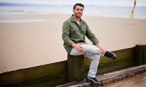 Picture of Sediq Shamal sitting on the beach in Rhyl