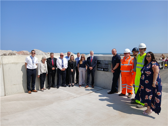 Group photo with plaque